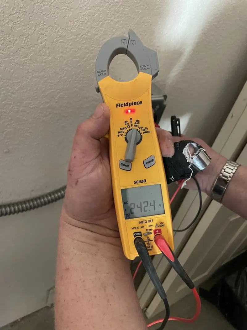 Voltage testing with clamp meter during Whole House Surge Protector in Ishpeming